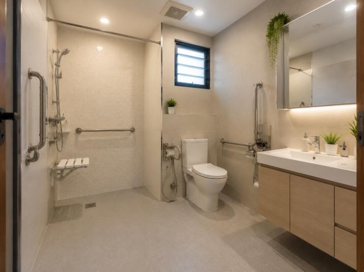 wide angle photo of a fully modified senior friendly bathroom, grab bars, non slip flooring, bright lighting, foldable shower seat visible, clean and bright