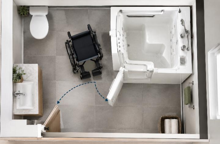 Top-down bathroom plan showing a wheelchair parked beside an L-shaped walk-in tub with the door swing drawn in
